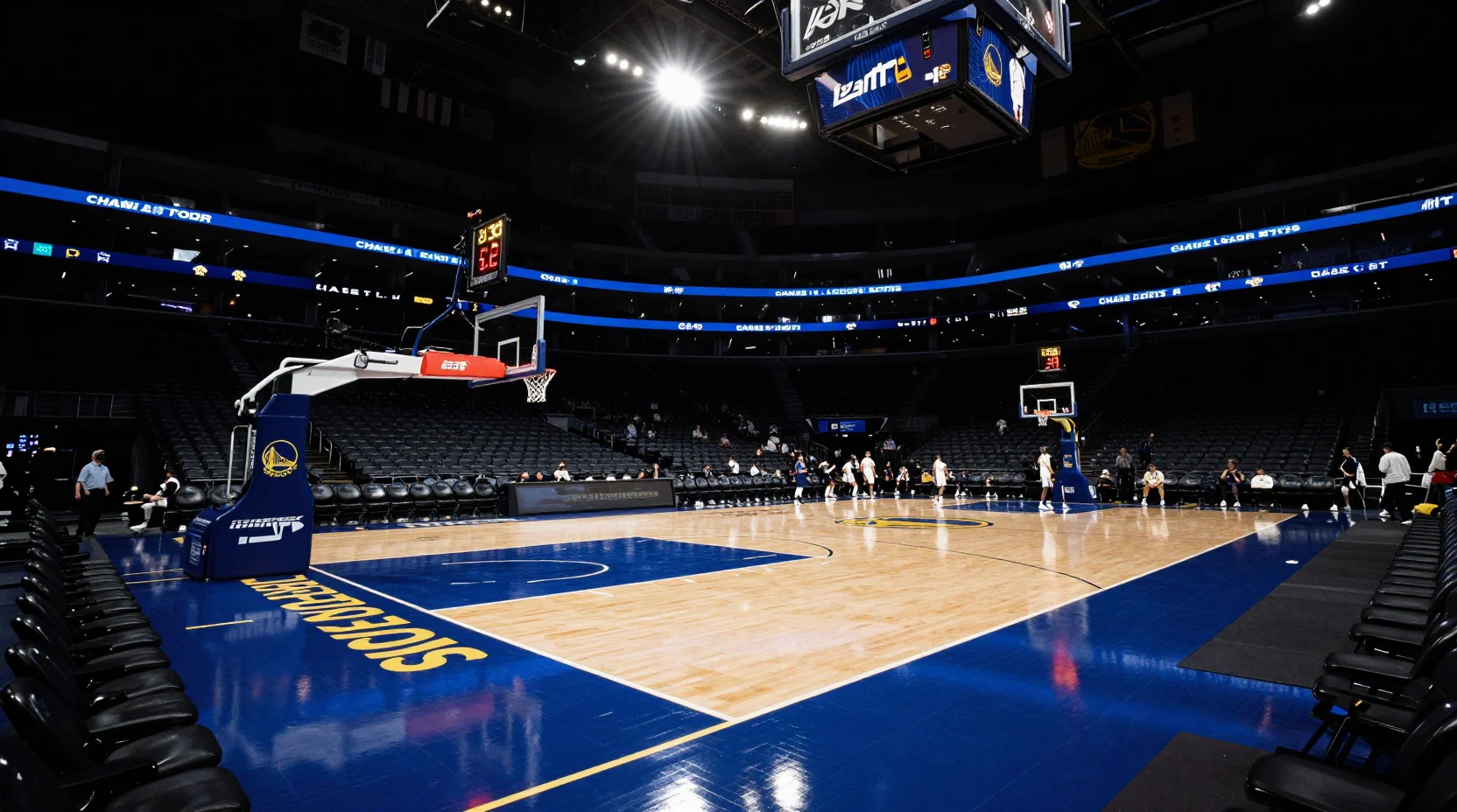 Dramatic basketball arena scene showing Warriors huddle at Chase Center