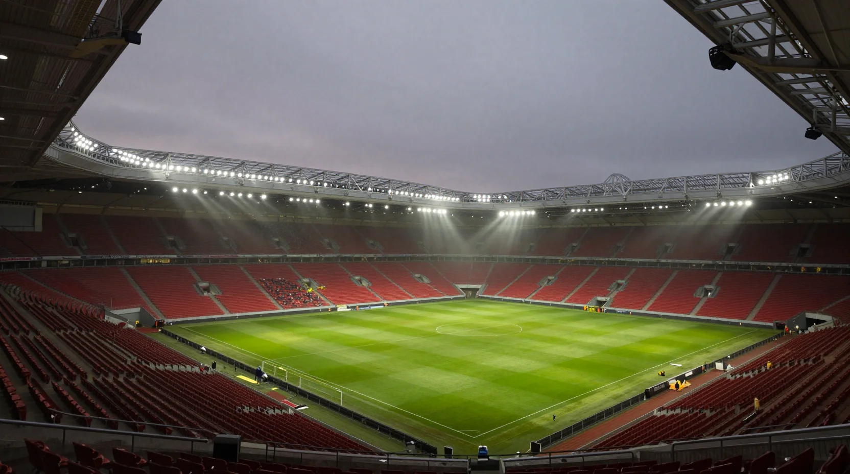 Ibrox Stadium atmospheric evening match with passionate Rangers supporters creating a sea of blue under floodlights