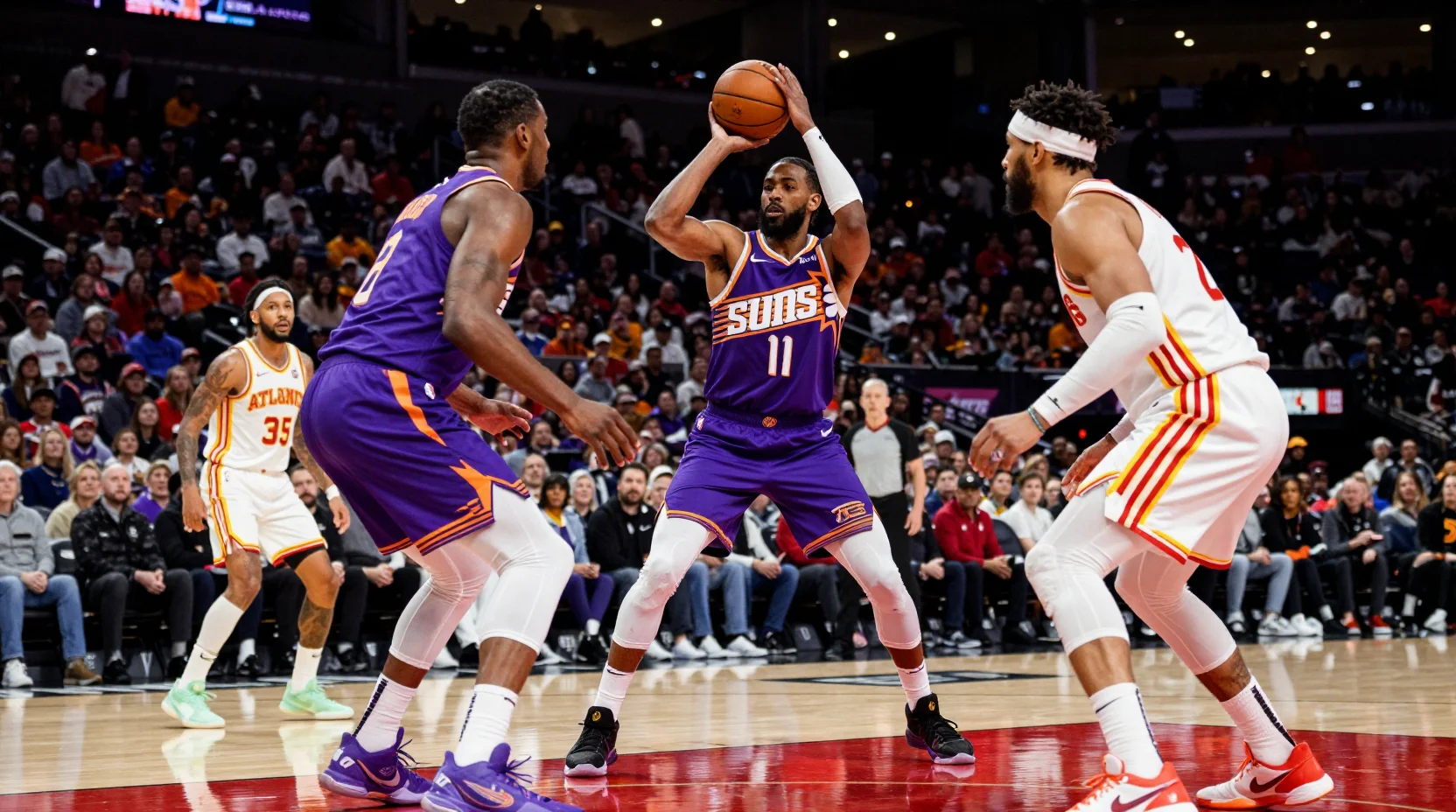 Intense NBA game moment with Phoenix Suns and Atlanta Hawks competing