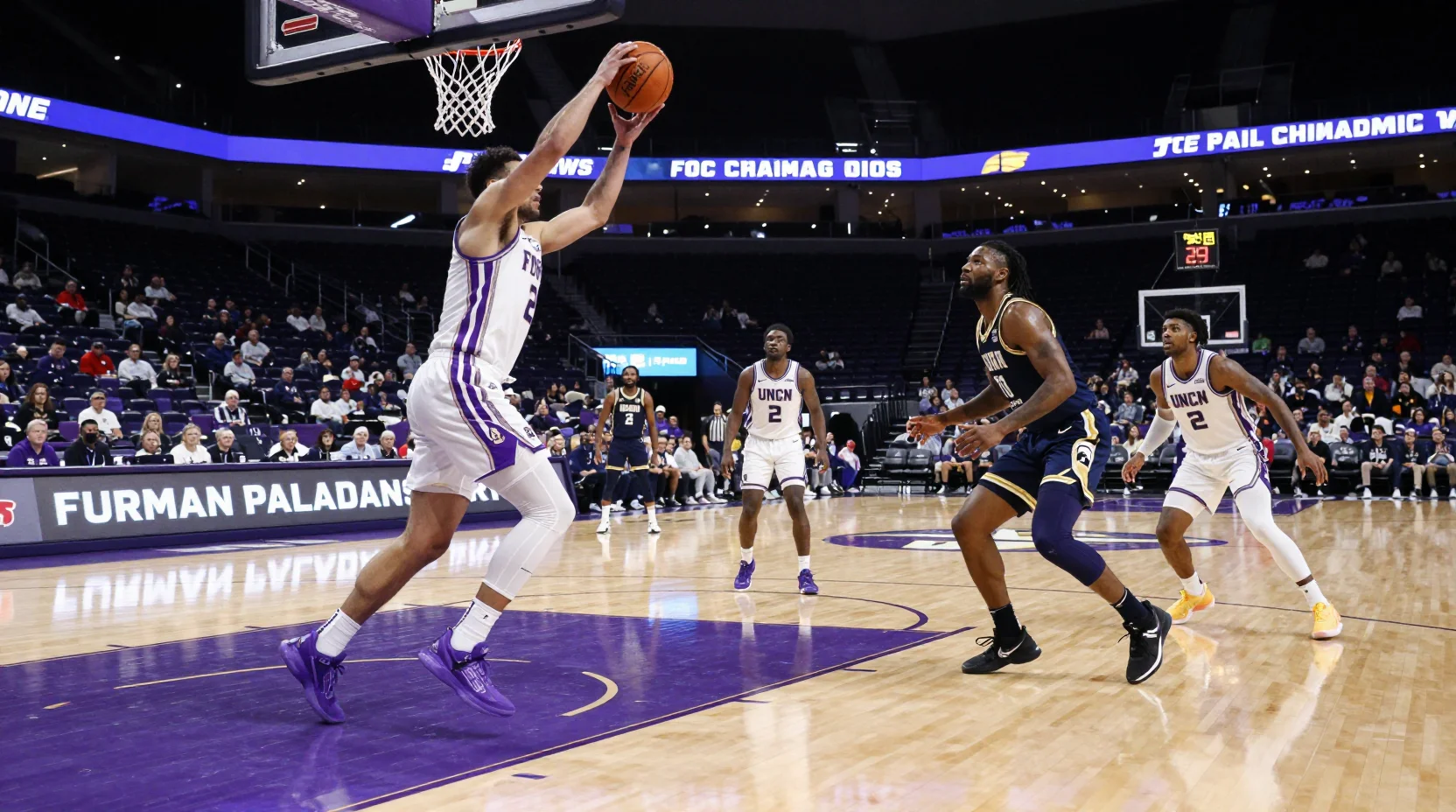 College basketball arena scene showing intense gameplay