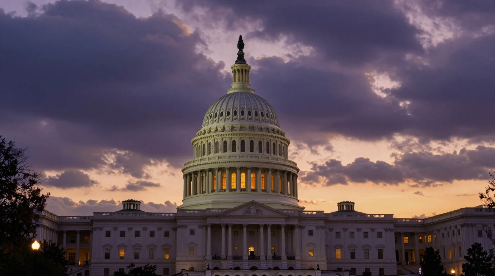 The United States Capitol building at dusk with dramatic storm clouds