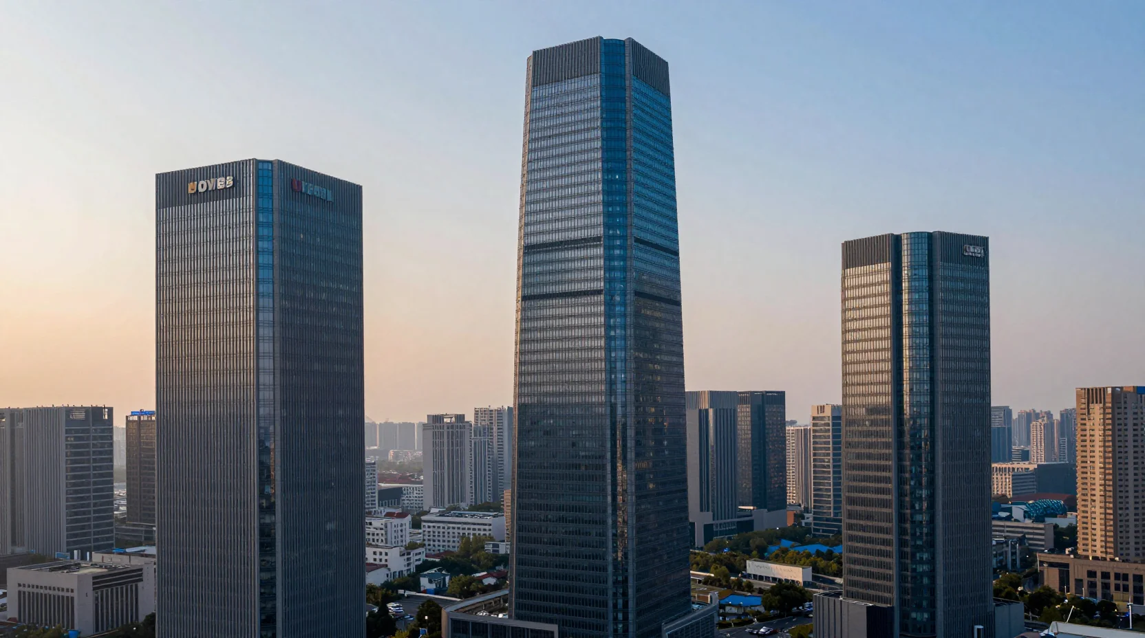 Three corporate towers representing market cap leaders