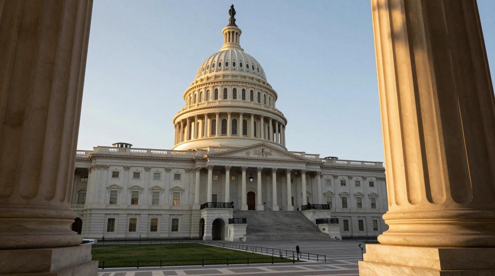 United States Capitol building at dusk with dramatic golden hour lighting