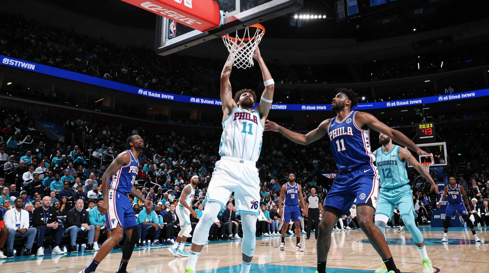 Dramatic NBA arena scene showing the intense matchup between the Philadelphia 76ers and Charlotte Hornets