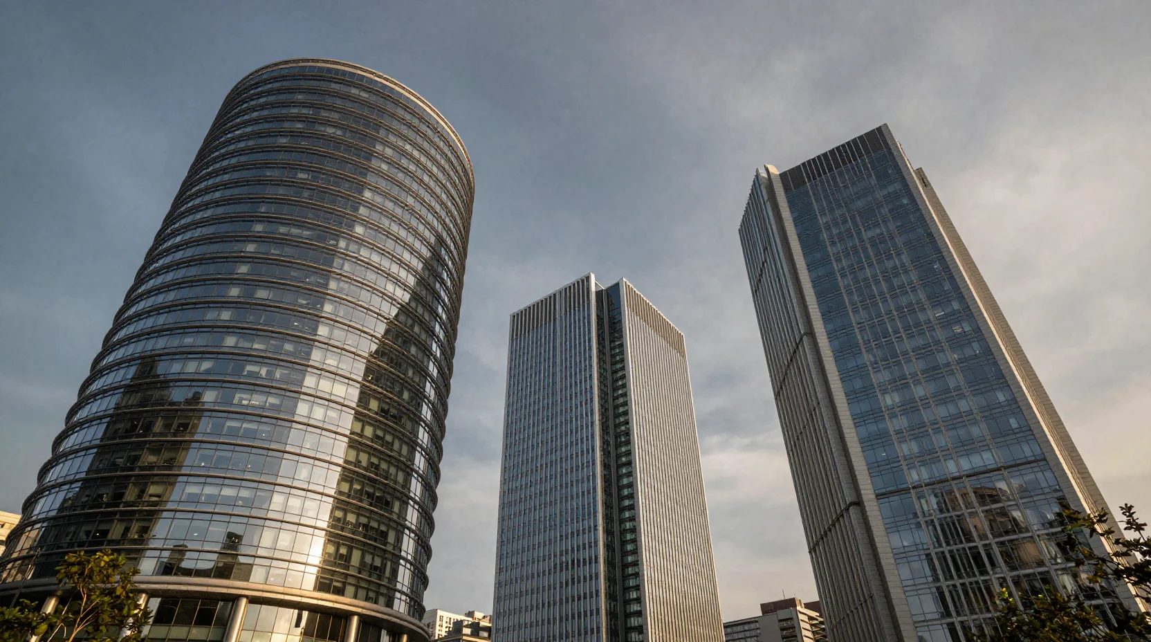 Three corporate headquarters competing for market cap leadership at twilight