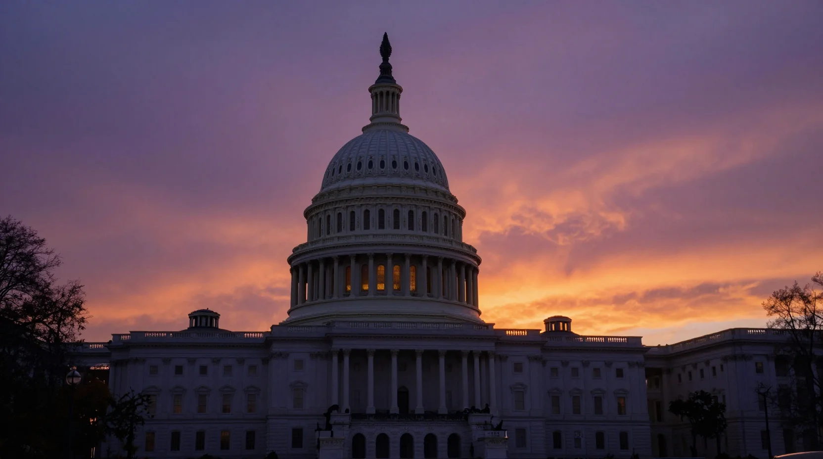 Dramatic twilight scene over Washington D.C. with the Capitol silhouetted against a deep purple and orange sunset sky