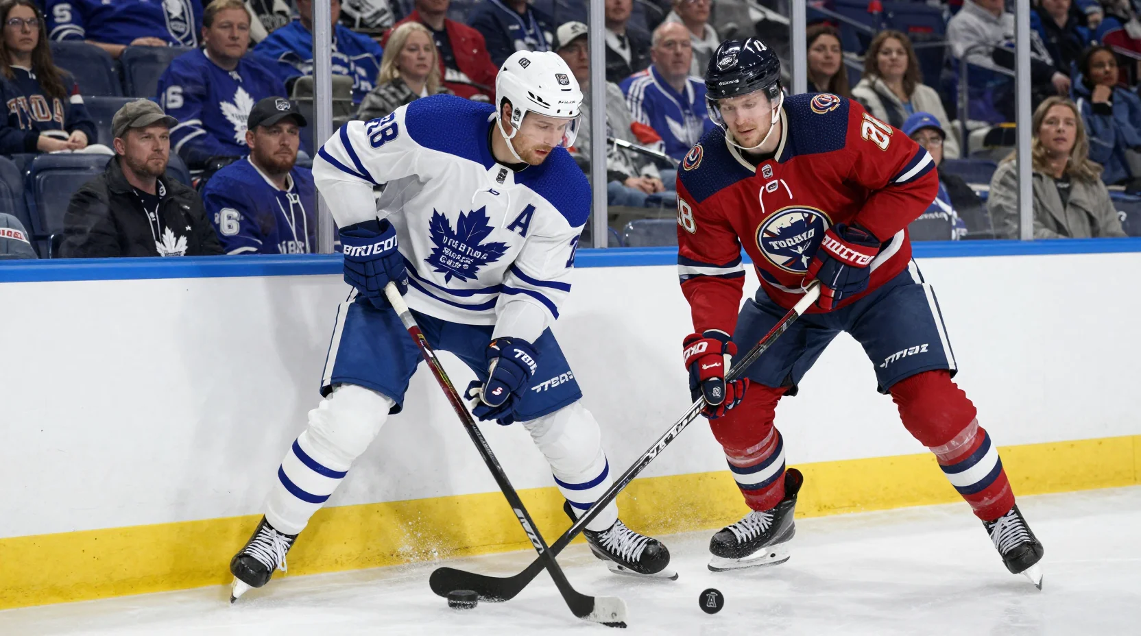 NHL hockey battle scene - Buffalo Sabres vs Toronto Maple Leafs players competing along the boards