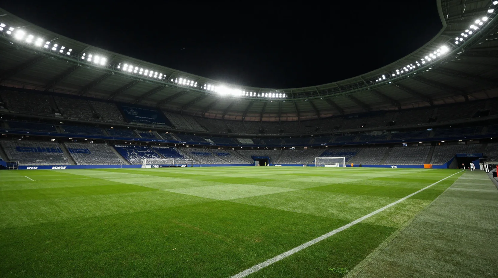 Dramatic nighttime scene at the Parc des Princes stadium in Paris for Champions League match